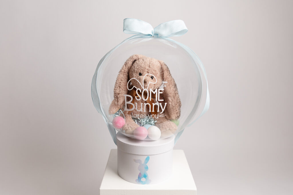 Baby’s First Easter balloon gift with plush bunny and pastel eggs inside clear balloon – personalized newborn Easter gift Glen Mills PA and Philadelphia Main Line.
