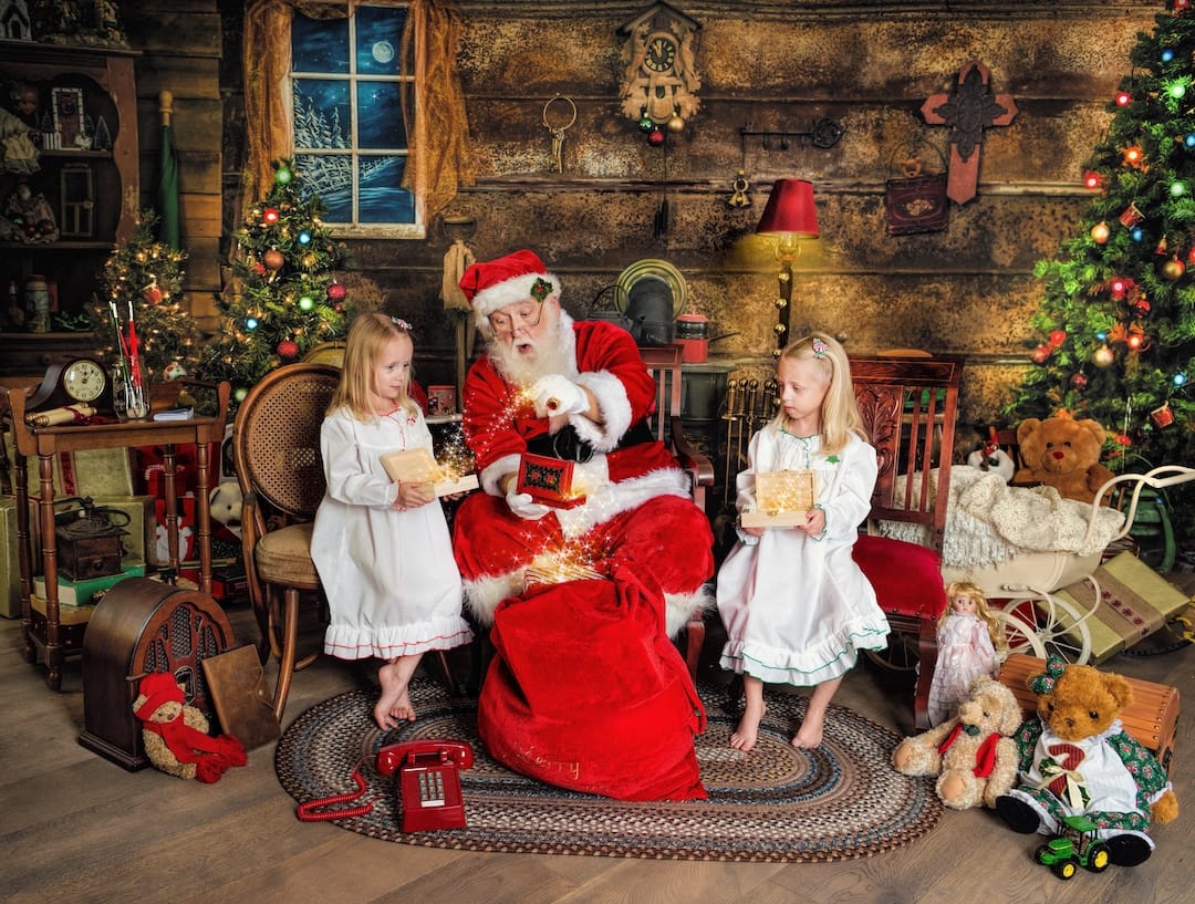 Children receive magical gifts from Santa during an interactive Christmas photography experience near Devon, PA.