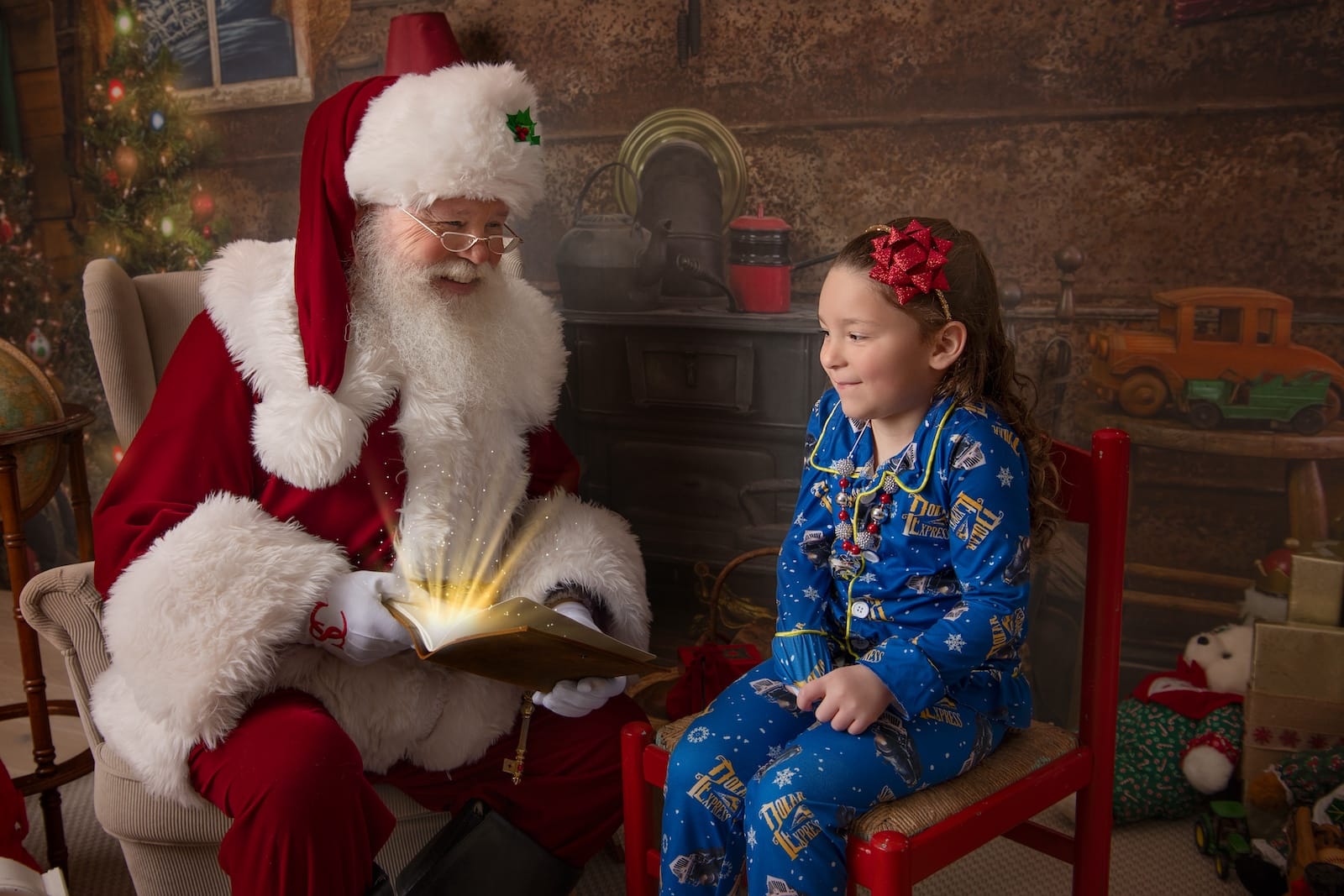 Santa reviewing the nice list with a child during an interactive Christmas session